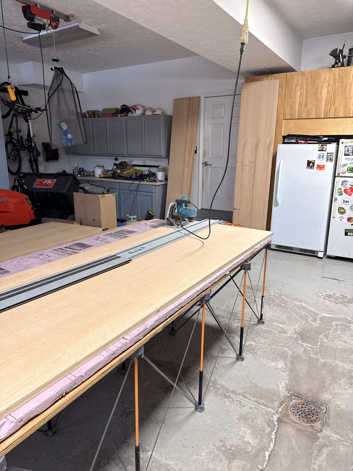 Bora Centipede, a sheet of plywood, inch and a half of rigid foam. That was the cutting station for 30 sheets of white oak.