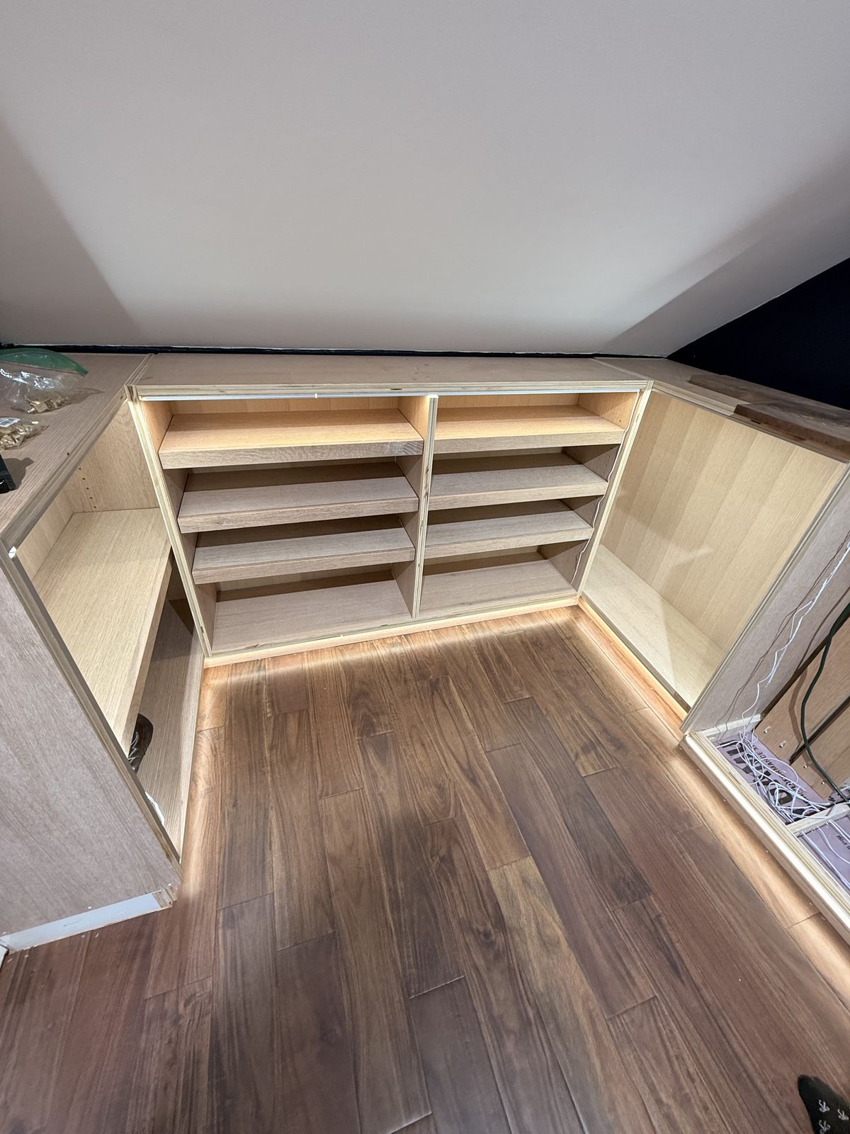 The finished white oak walk in closet