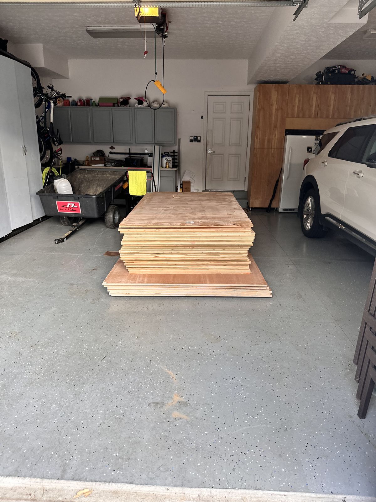 30 sheets of architectural grade rift sawn white oak plywood staged for the closet build.